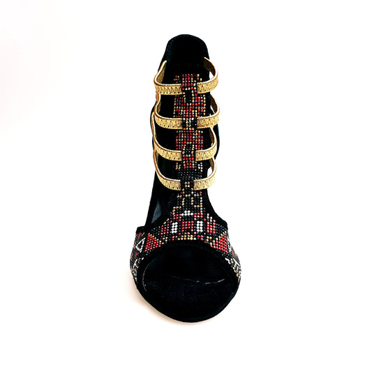 Sandalo donna Sara Gold Plus in camoscio nero con dettagli oro, tacco a stiletto laminato e elastici dorati.