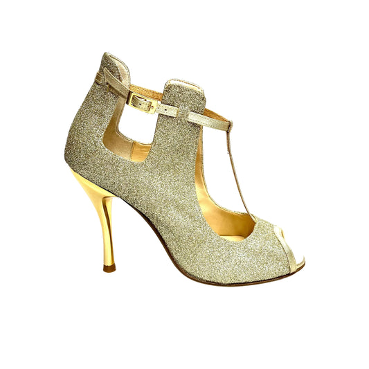 Scarpa Jenny Wish Dance Shop in glitter oro platino con cinturini in lurex oro e tacco a spillo laminato oro.