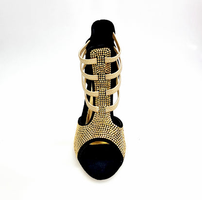 Sandalo donna Dora 460PW in camoscio nero con elastici oro, borchiette oro e tacco a spillo laminato oro.