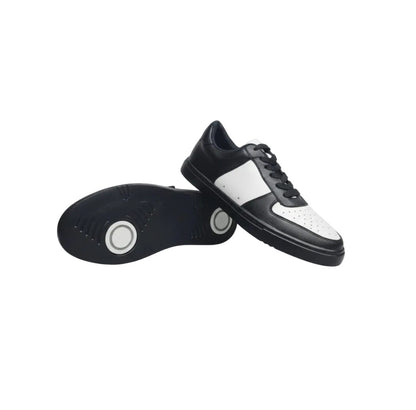 Sneaker Wish Dance Shop REY in ecopelle vegana bianca e nera, suola in gomma e resina, con cerchi bianchi e design moderno.