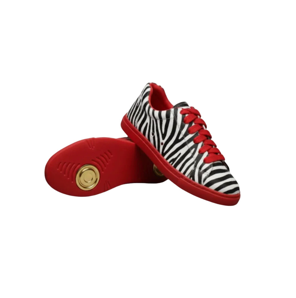 Sneaker vegan ATACA Zebry Red Gold Vortex in tessuto zebrato con suola rossa, dettagli in oro e resina, comfort e flessibilità.