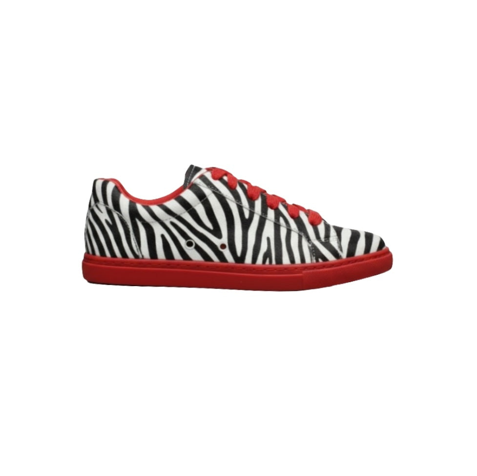 Sneaker Wish Dance Shop ATACA Zebry Red Gold Vortex in tessuto zebrato vegano con suola rossa in gomma e resina, dettagli in oro.