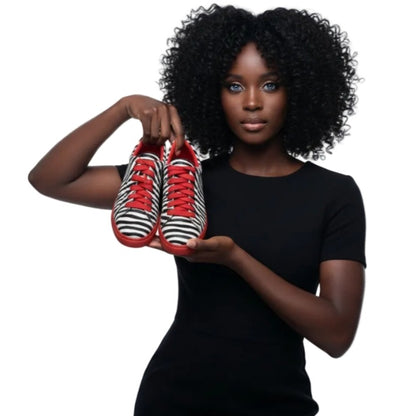 Sneaker Wish Dance Shop ATACA Zebry Red Gold Vortex in tessuto zebrato, suola rossa in gomma, dettagli oro e resina, stile vegano.