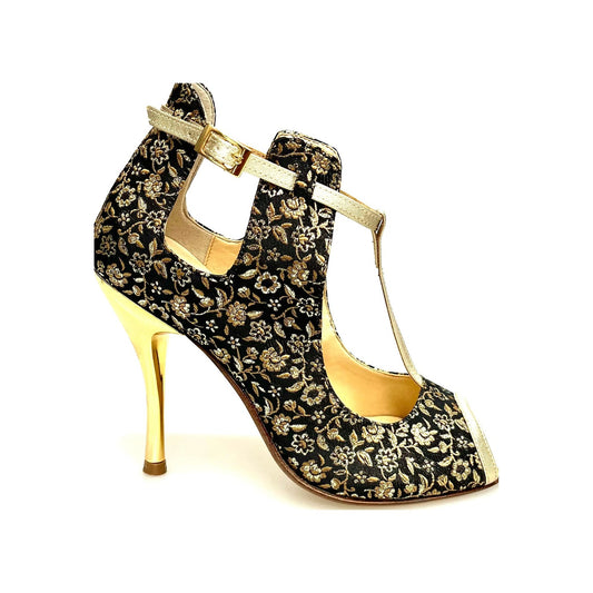 Scarpa Jenny in Cate Fiorato Veneziano oro con profili lurex oro e tacco a spillo laminato oro, elegante e brillante.
