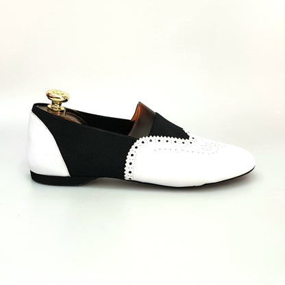 Scarpe da jazz Roly Jazz 06 in pelle bianca con elastico nero e suola divisa in resina di gomma, stile elegante e comodo.