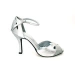 Cargar imagen en la Galería, Scarpa donna Wishdance Ely QA in pelle argento e glitter, cinturino alla caviglia e tacco rocchettino, elegante e brillante.
