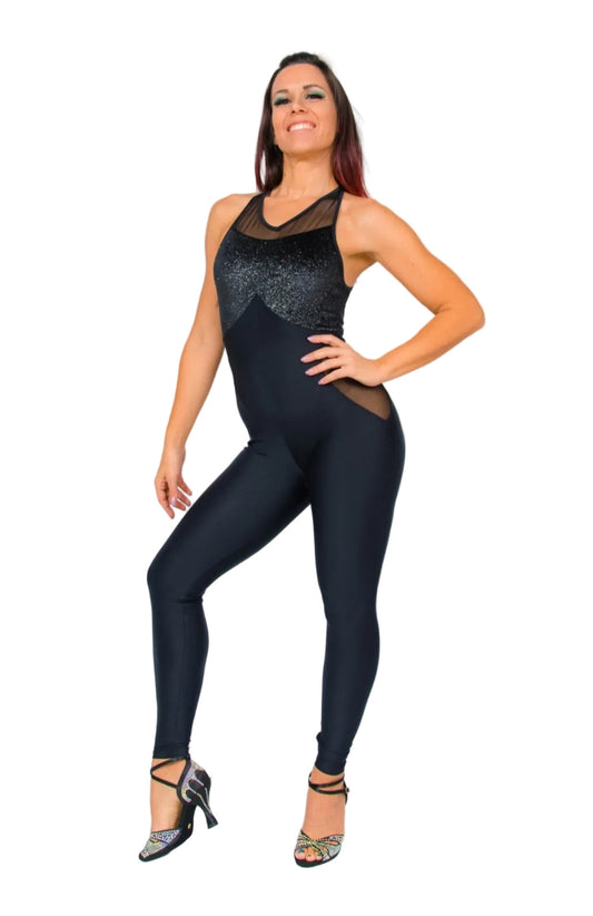Completo jumpsuit nero in ciniglia con dettagli glitter argento, morbido e modellante, visibile in immagine.