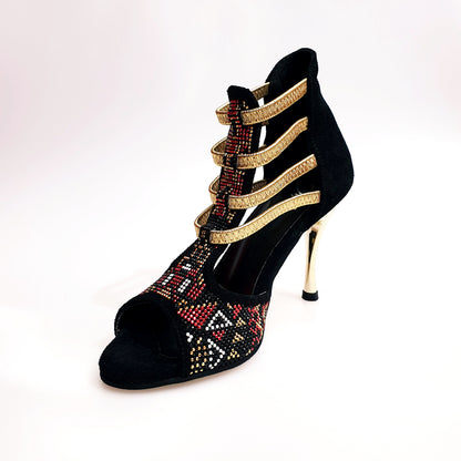 Sandalo da donna Sara Gold Plus Wish Dance Shop in camoscio nero con dettagli oro, tacco a spillo laminato e elastici dorati.