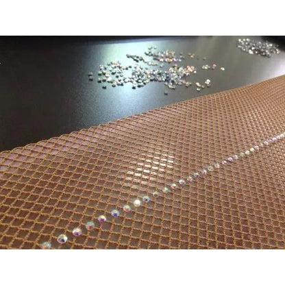 Collant professionale in rete Loren Swarovski con pietre Swarovski Boreali, zona posteriore coscia e polpaccio, effetto modellante e massaggiante