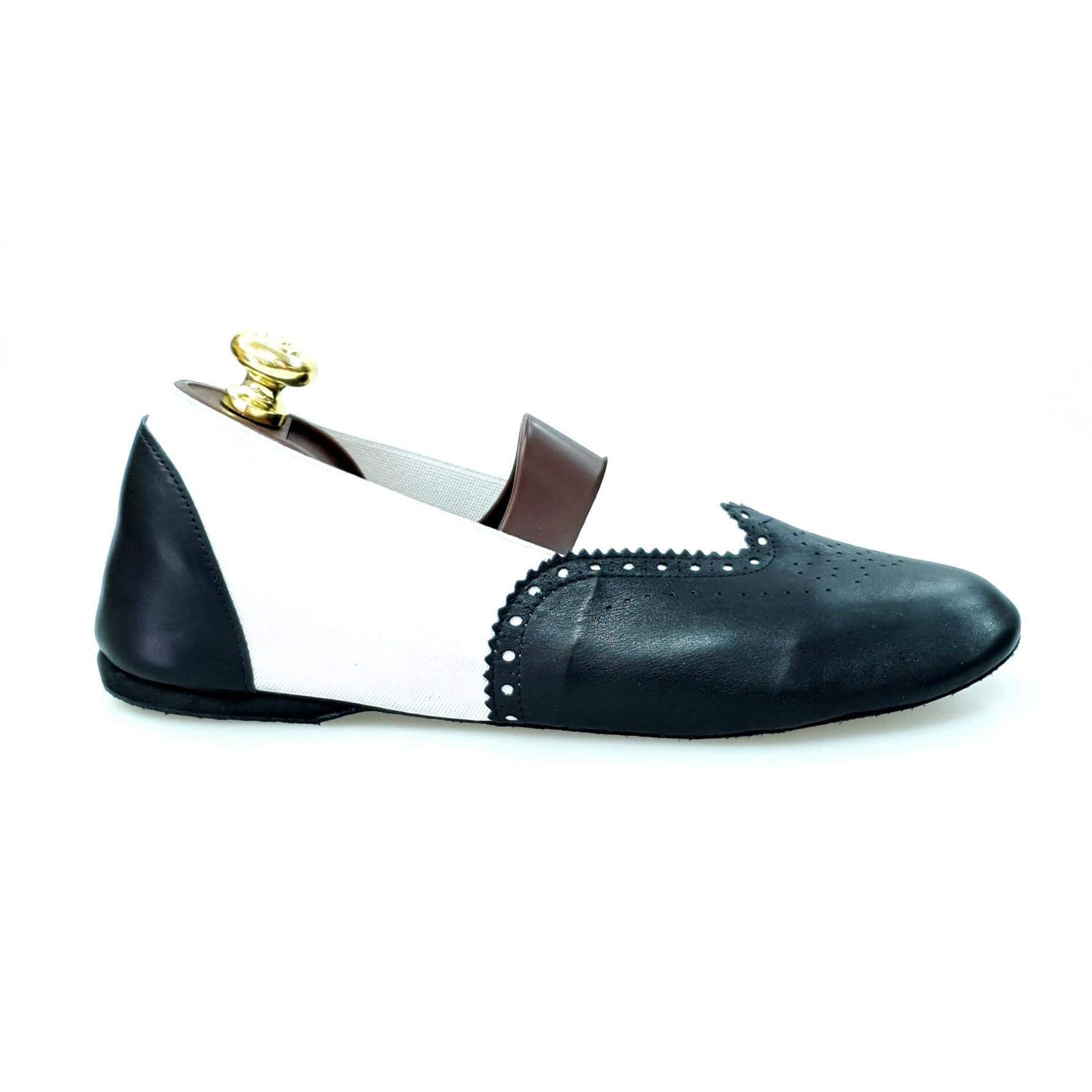 Scarpa jazz Roly Jazz 06 in pelle nera con elastico bianco e suola bufalo, comoda e flessibile, ideale per danza.