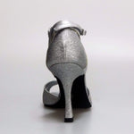 Cargar imagen en la Galería, Scarpa donna Wishdance Ely QA in pelle argento e glitter, cinturino alla caviglia, tacco rocchetto, stile elegante e brillante
